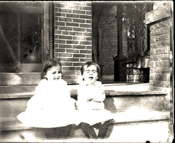 Cousins Ada Redhead (George's Daughter) and Herbert Henry Redhead back porch outside kitchen door