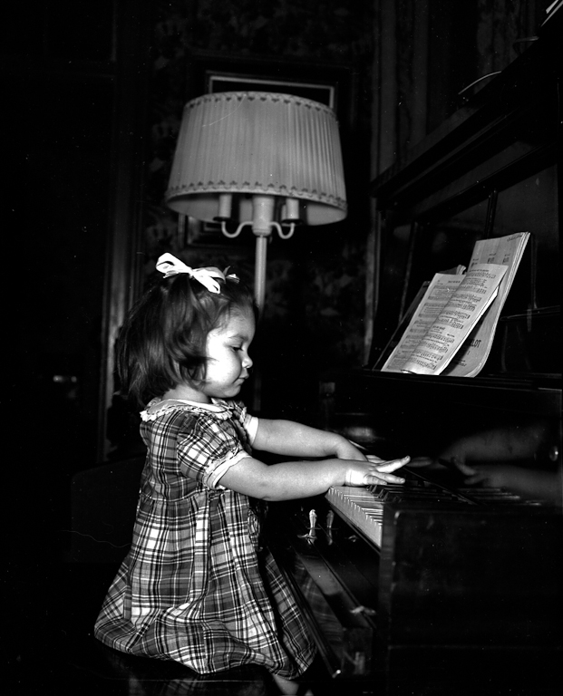 Linda Jean Gilchrist playing the player piano.
