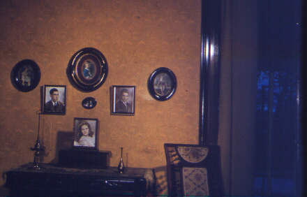 Seven Gables - Family Portraits - Whale Oil Lamp, Music Box on table