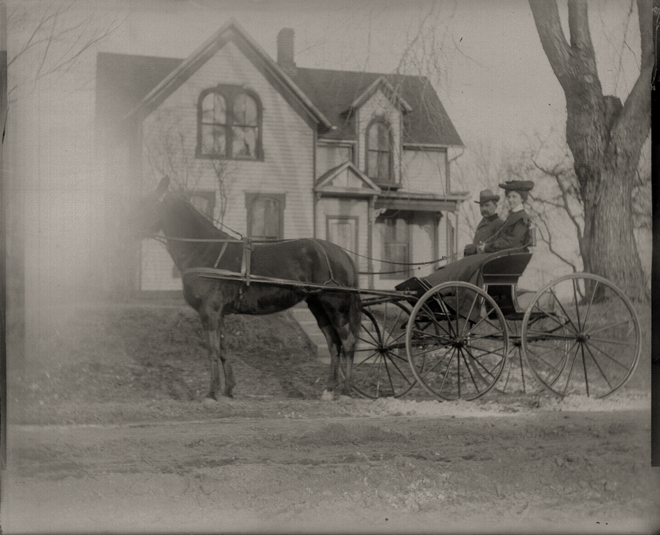 Uncle Horris and Aunt Jessie Hollingsworth in front of their house